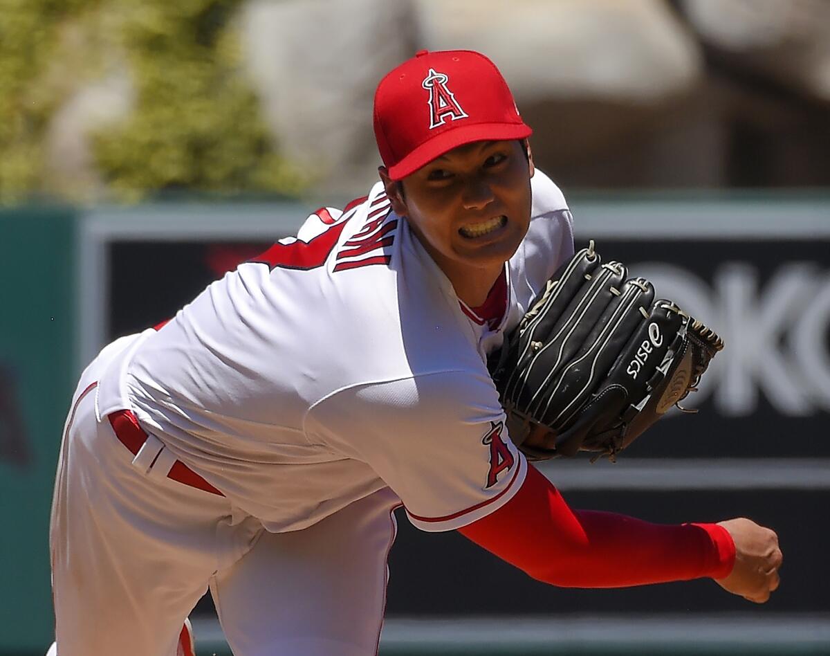 Los Angeles Angels pinch hitter Shohei Ohtani wears a jersey with his  nickname SHOWTIME on the back as he bats in the eighth inning during the  Major League Baseball game against the