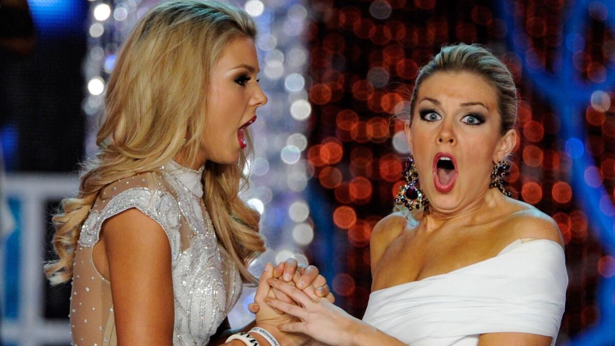 Ali Rogers, left, Miss South Carolina, and Mallory Hytes Hagan, Miss New York, react after the announcement of the new Miss America in 2013.