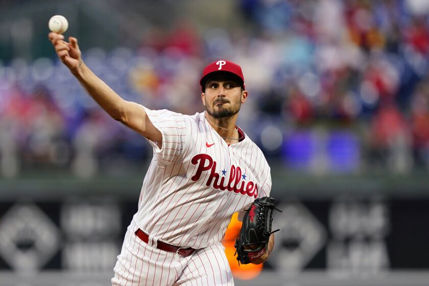 FILE - Philadelphia Phillies' Zach Eflin pitches during the first inning of the team's baseball game against the Colorado Rockies, April 26, 2022, in Philadelphia. Eflin has agreed to join the Tampa Bay Rays on a three-year, $40 million contract that’s the largest the club has ever awarded in free agency, a person familiar with the deal told The Associated Press. (AP Photo/Matt Slocum)