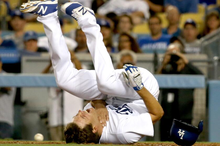 LOS ANGELES, CALIF. - JULY 19, 2017. Dodgers starter Rich Hill falls to the ground after being hit by a pitch from Padres starter Clayton Richard in the fourth inning Friday, Aug. 11, 2017, at Dodger Stadium in Los Angeles. (Luis Sinco/Los Angeles Times)