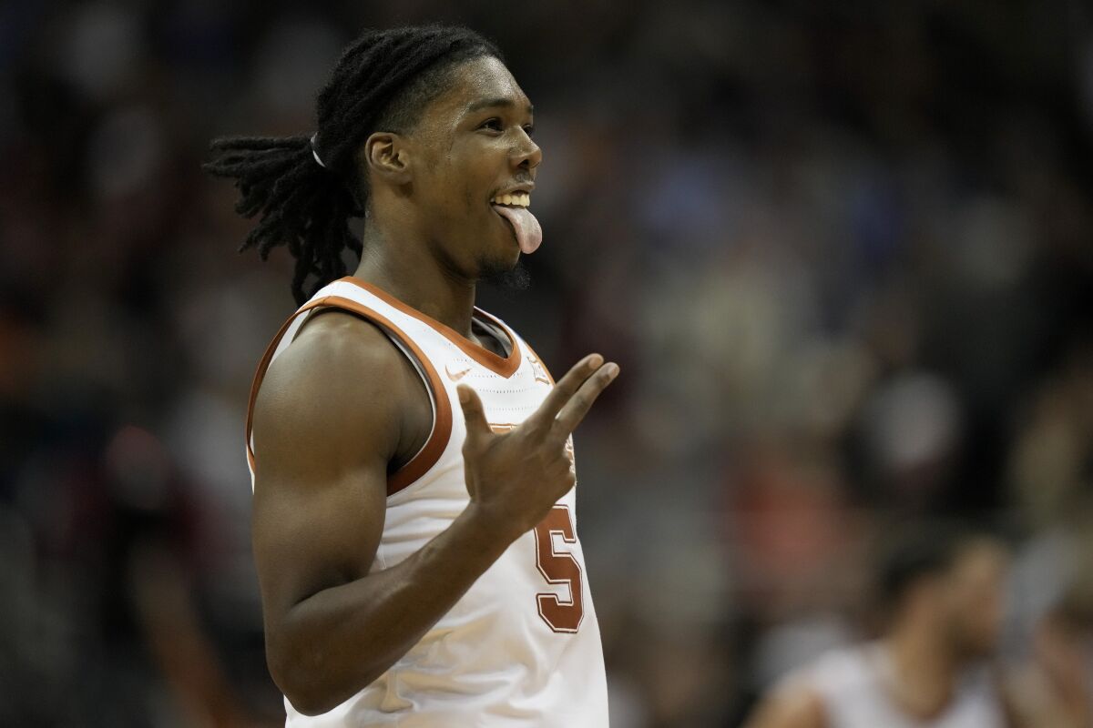 Texas guard Marcus Carr celebrates after scoring against Xavier in the first half of a Sweet 16 college basketball game in the Midwest Regional of the NCAA Tournament Friday, March 24, 2023, in Kansas City, Mo. (AP Photo/Charlie Riedel)