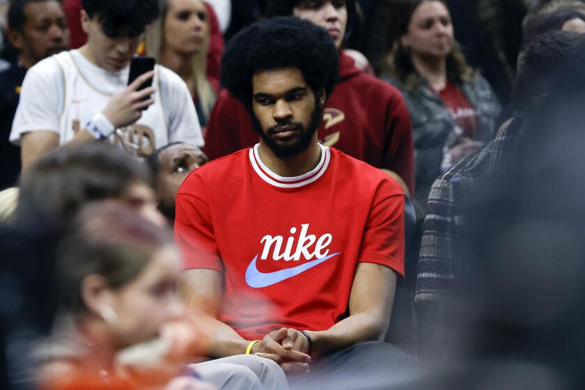 Injured Cleveland Cavaliers center Jarrett Allen sits on the bench during the second half of Game 5 of an NBA basketball first-round playoff series against the Orlando Magic, Tuesday, April 30, 2024, in Cleveland. (AP Photo/Ron Schwane)