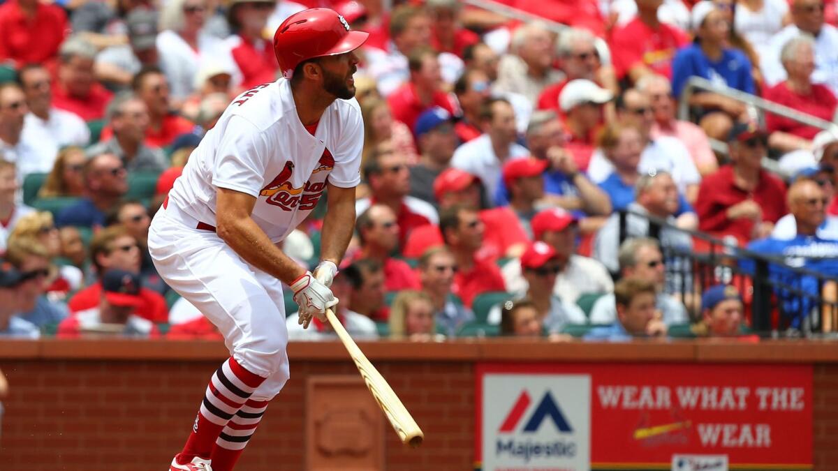 Cardinals pitcher Adam Wainwright hits a two-run home run against the Dodgers on June 1.