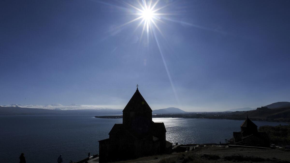 Tourists visit the Sevanavank monastic complex on the banks of Sevan Lake in Armenia.