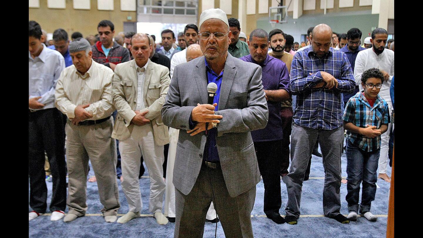 Imam Sayed Rashed leads a prayer at the Pacific Community Center where the Glendale Muslim community participate in 9/11 commemoration on Monday, September 12, 2016. Members of the Glendale Fire and Police departments were there, as well as Glendale City Council.