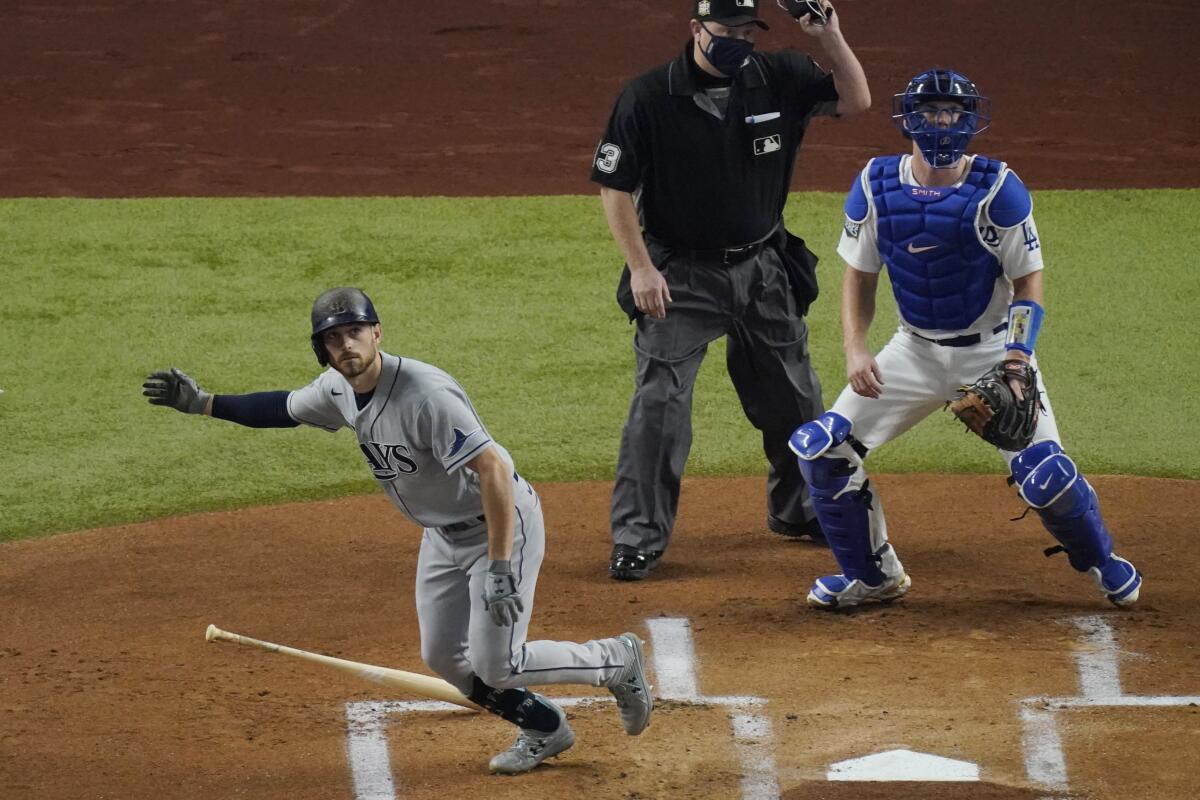 Tampa Bay Rays' Brandon Lowe watches his home run during the first inning in Game 2 of the World Series