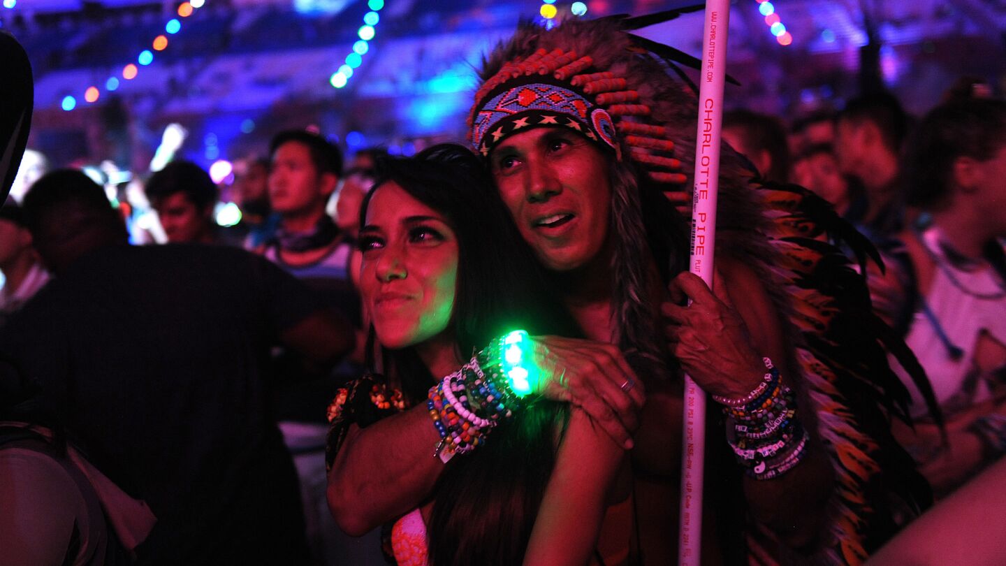 A couple watches an act at the Cosmic Meadow stage during the Electric Daisy Carnival in Las Vegas on June 17.