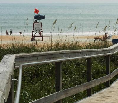 A boardwalk shows the way to the beach.