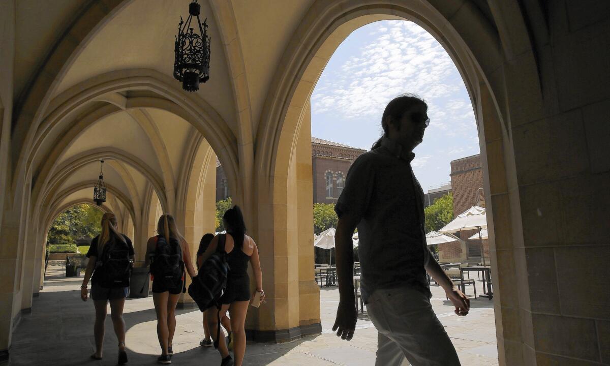 Students walk into Ackerman Hall at UCLA. The California DREAM low-interest loans are designated for immigrants in the country illegally who are enrolled at University of California or California State University campuses.