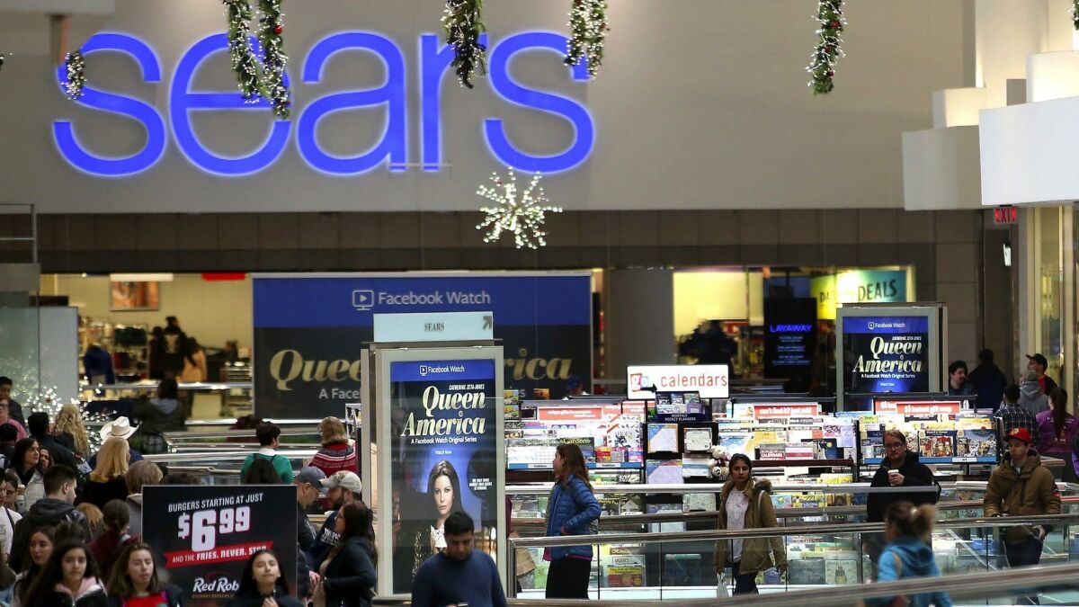 Shoppers outside a Sears store in Schaumburg, Ill., on Black Friday 2018.