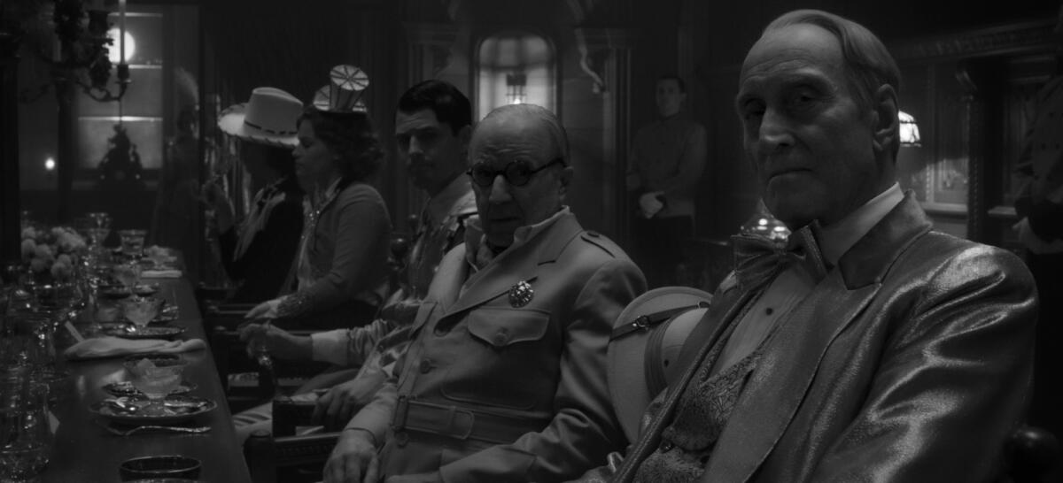 Arliss Howard as Louis B. Mayer and Charles Dance as William Randolph Hearst in the movie "Mank."