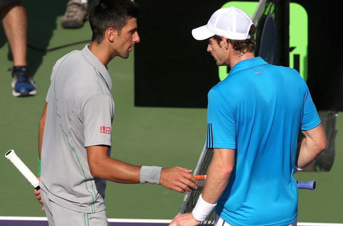Novak Djokovic, left, and Andy Murray discuss a controversial point at the end of the first set during their quarterfinal match at the Sony Open in Key Biscayne, Fla.