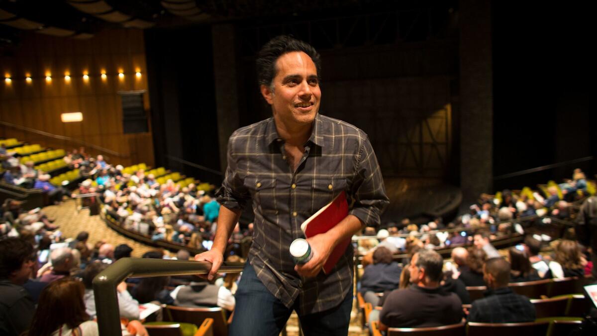 Playwright Rajiv Joseph walks to his seat for the world premiere of his new play, "Archduke," at the Mark Taper Forum in Los Angeles.