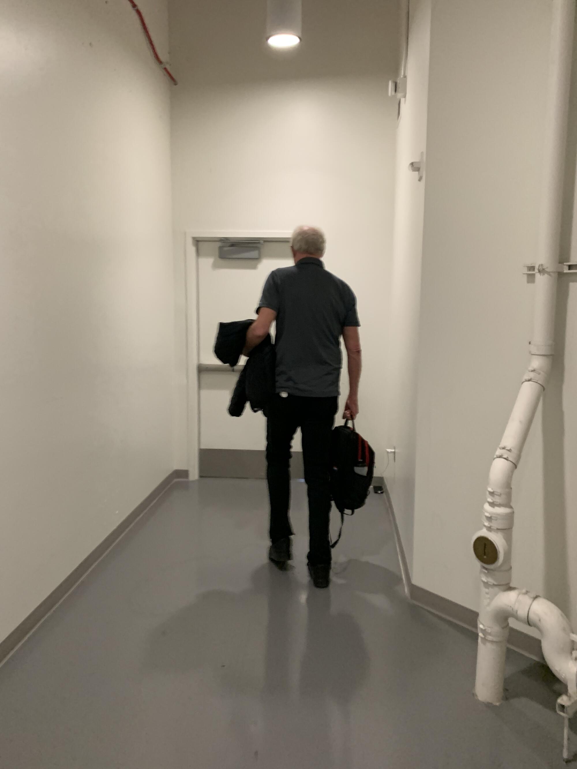 Bill Walton heads for a door at Pauley Pavilion on the UCLA campus in March 2022.