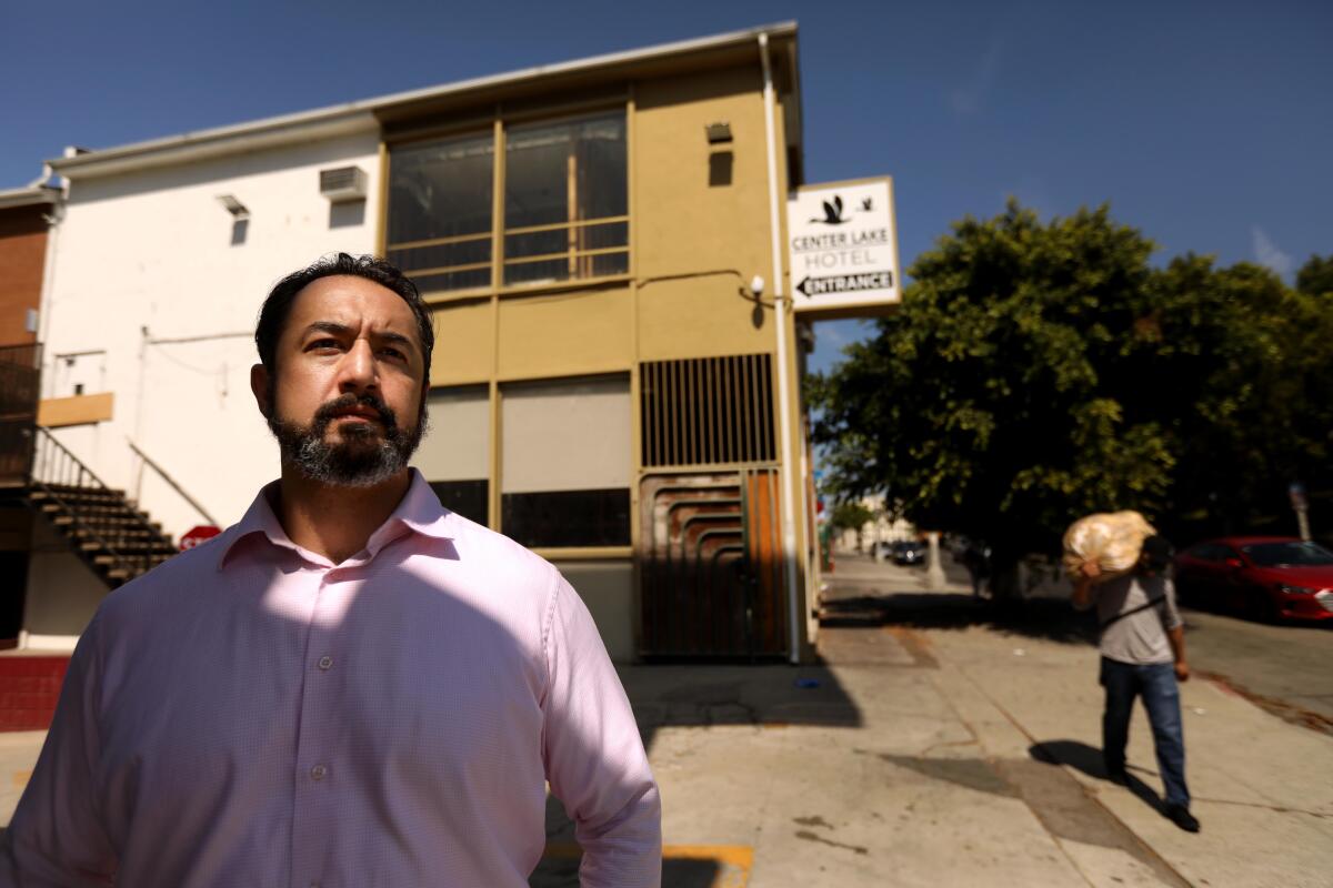 Marcos De La Toba, a former tenant at the Royal Park Motel, in front of the building at the center of numerous lawsuits.
