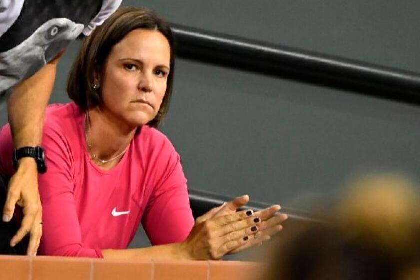 Tennis coach and former player Lindsay Davenport claps for Madison Keys after Keys defeated Naomi Osaka at the BNP Paribas Open tennis tournament on Mar. 13.