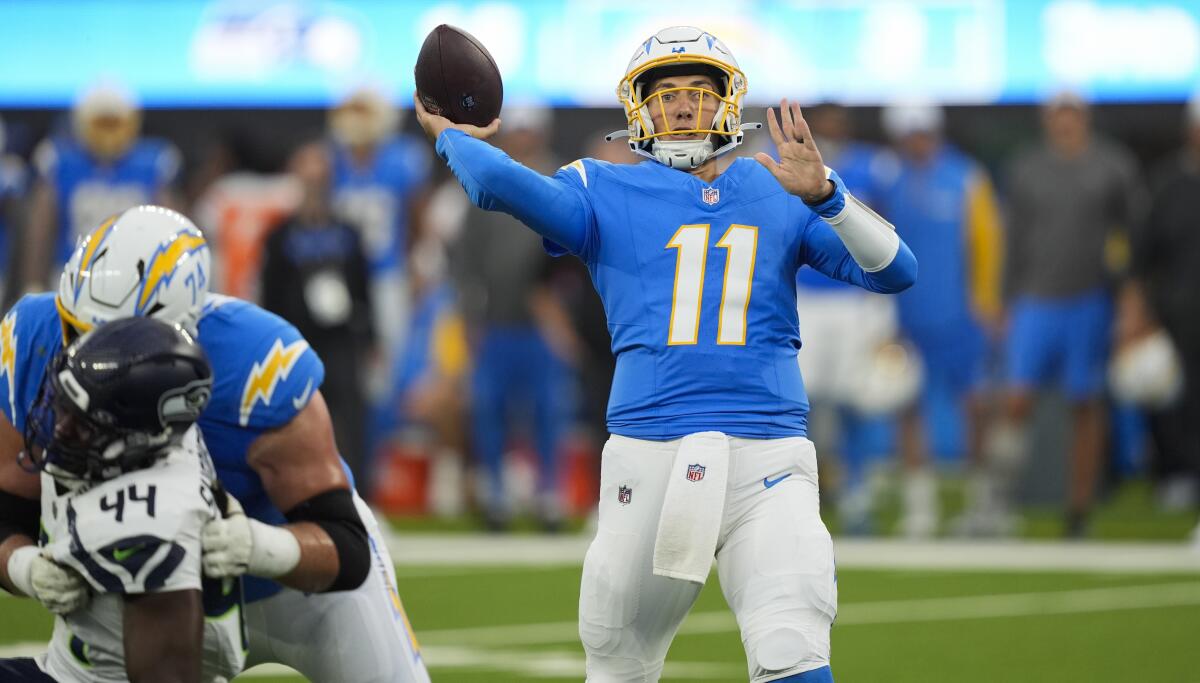 Chargers quarterback Luis Perez (11) passes against the Seattle Seahawks in their preseason game.