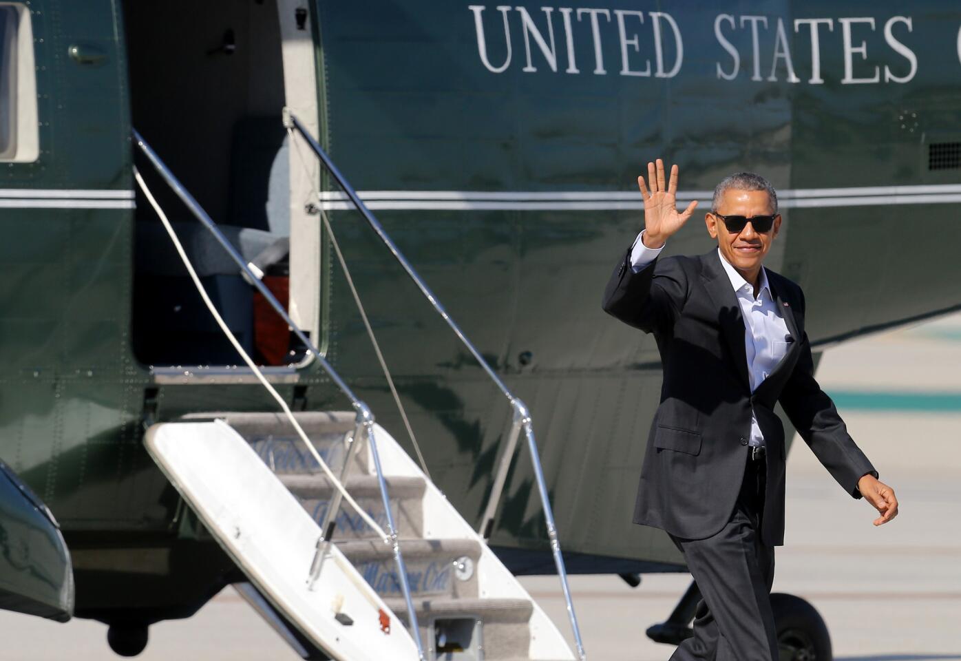 President Barack Obama waves to the assembled press as he arrives at Los Angeles International Airport aboard Marine One. He boarded Air Force One at LAX and headed to Palms Springs to meet with leaders at a summit for Southeast Asian leaders.