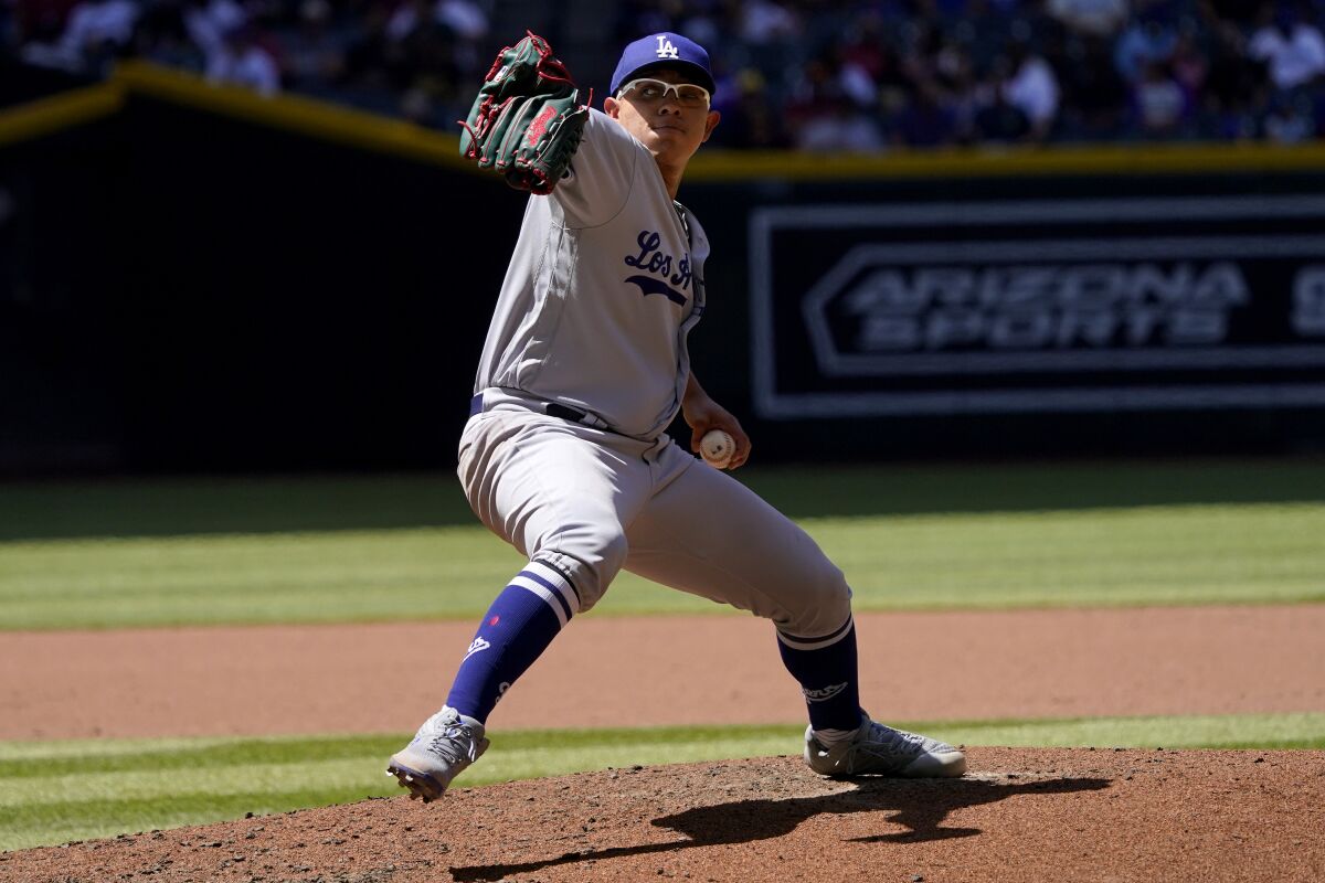 Dodgers starting pitcher Julio Urías throws against the Arizona Diamondbacks on April 27.