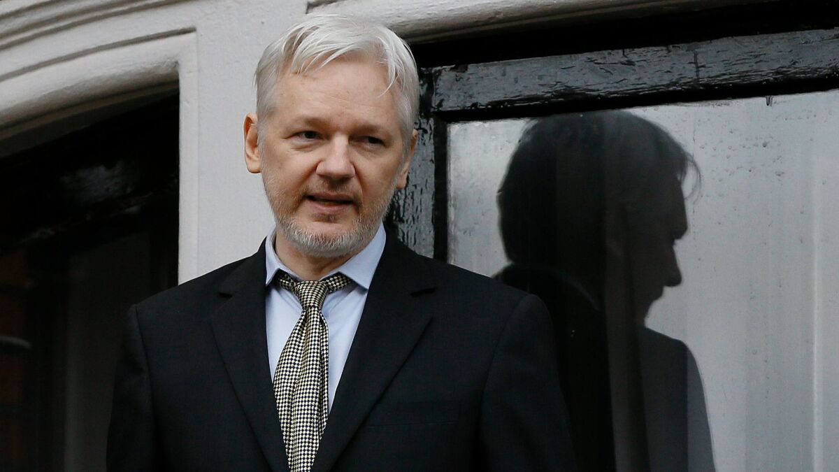 WikiLeaks founder Julian Assange speaks in 2016 from the balcony of the Ecuadorean Embassy in London, where he has been holed up since jumping bail in 2012.