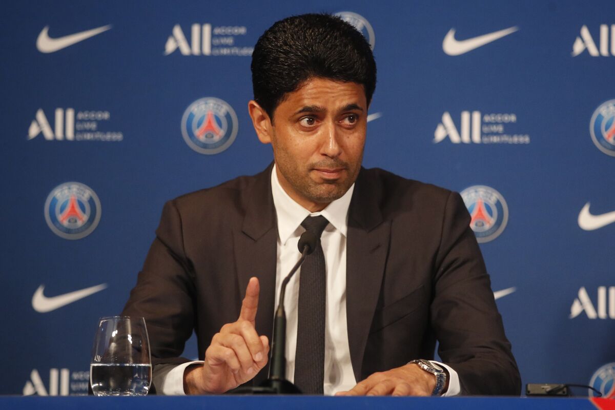 PSG president Nasser Al-Khelaifi makes point during a press conference Monday, May 23, 2022 at the Paris des Princes stadium in Paris. Kylian Mbappé's decision to reject Real Madrid and commit to Paris Saint-Germain for three more seasons marks the start of a large rebuilding project at the French league champion. (AP Photo/Michel Spingler)