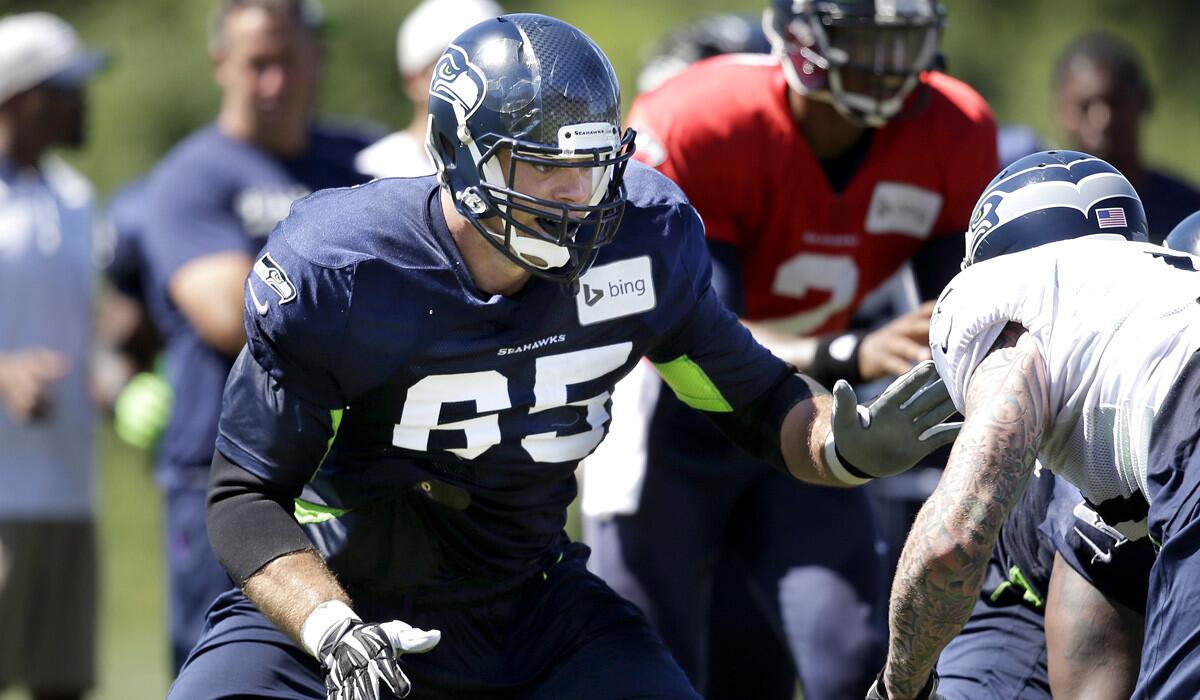NFLPA President Eric Winston, who was cut in late August, takes part in a Seahawks scrimmage during summer camp.