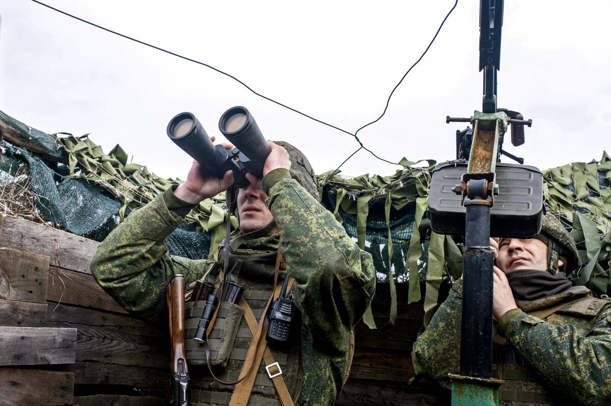 Pro-Russian Servicemen on the observation post watching for Ukrainian drones