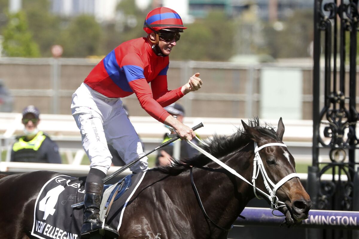 Verry Elleegant ridden by James McDonald crosses the finish line to win the Melbourne Cup horse race in Melbourne, Australia, Tuesday, Nov. 2, 2021. (AP Photo/Asanka Ratnayake)