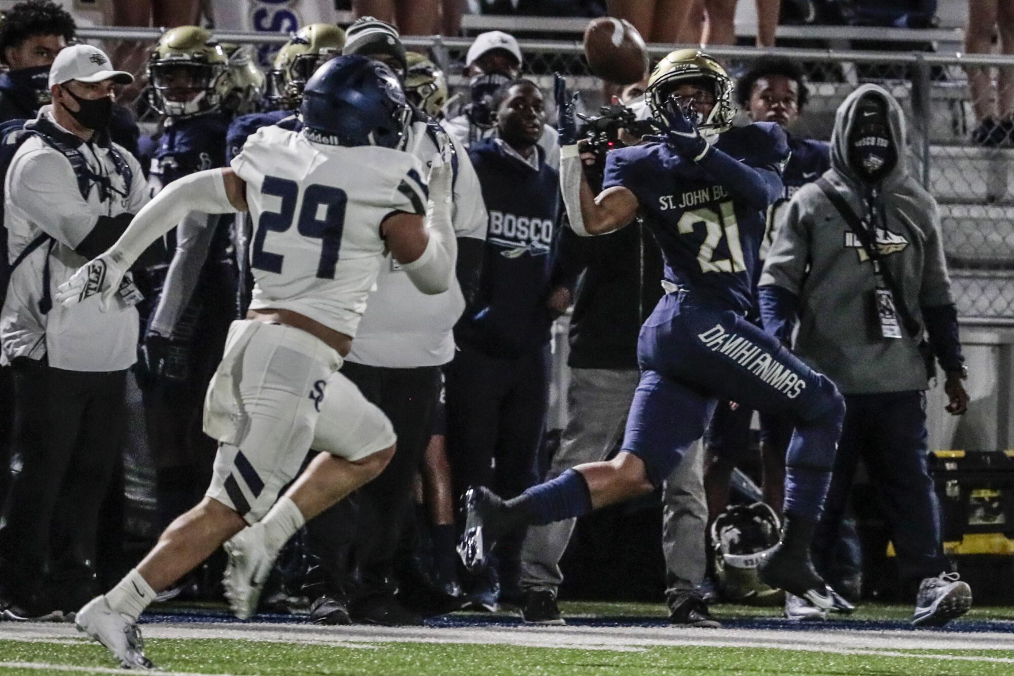 St. John Bosco running back Rayshon Luke hauls in a long pass.