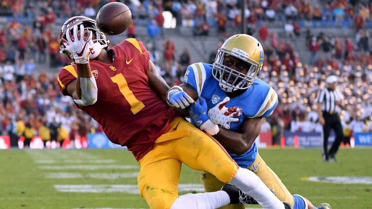 UCLA defensive back Adarius Pickett breaks up a pass intended for USC receiver Velus Jones Jr. Nov. 17.