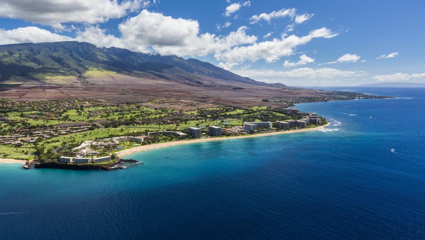 Located north of Lahaina, Maui's Kaanapali Beach, with its three miles of white sand, is a favorite with locals. It's also home to popular hotels and resorts.