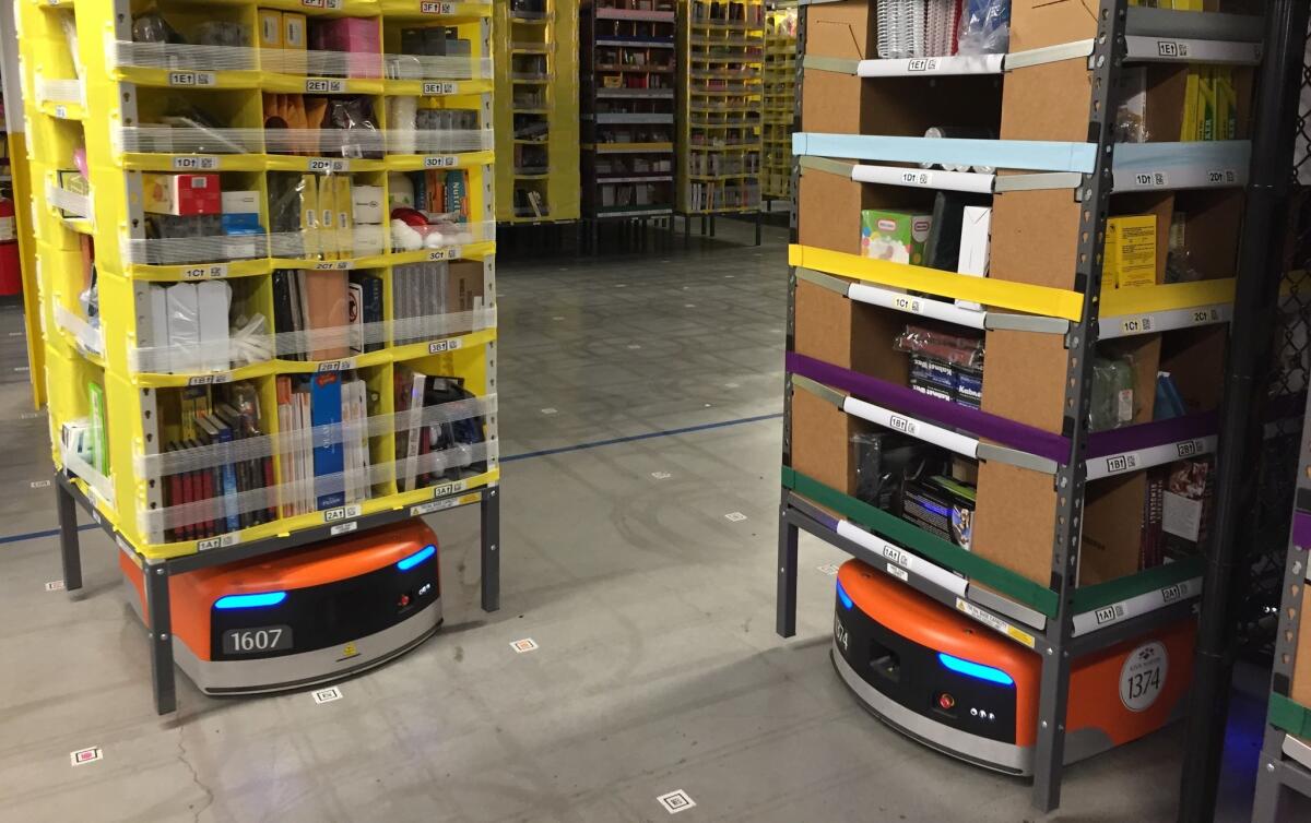 Amazon's orange Kiva robots lift stacks of merchandise and move them to employee stations. A new generation of warehouse robots from Locus Robotics will be able to travel long distances and scale high shelves that are out of reach of humans.