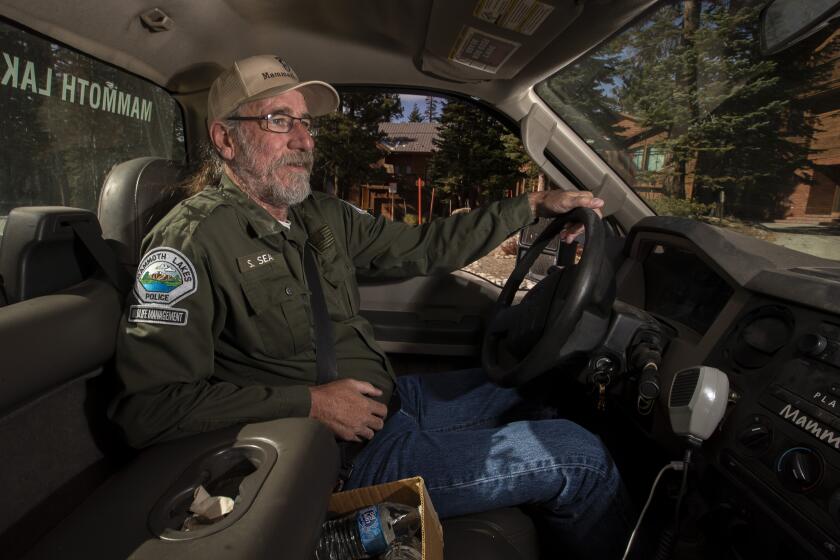 MAMMOTH LAKES, CALIF. -- THURSDAY, OCTOBER 17, 2019: Mammoth Lakes Wildlife Specialist Steve Searles, a former surfer from Newport Beach who moved to Mammoth 40 years ago, on patrol in the town of Mammoth Lakes, Calif., on Oct. 17, 2019. (Brian van der Brug / Los Angeles Times)