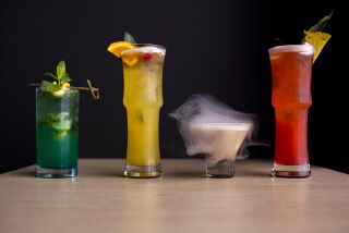 Costa Mesa, CA - September 14: The Blue Apple Mojito, left, the Mai Thai Not Yours, the Butterscotch Smoke Bubble, and the Singapore Sling from Paradise Dynasty at South Coast Plaza on Wednesday, Sept. 14, 2022 in Costa Mesa, CA. (Scott Smeltzer / Daily Pilot)