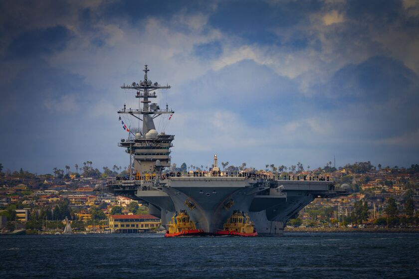 The Nimitz-class aircraft carrier Theodore Roosevelt makes her way into San Diego on Thursday, March 23, 2023. 