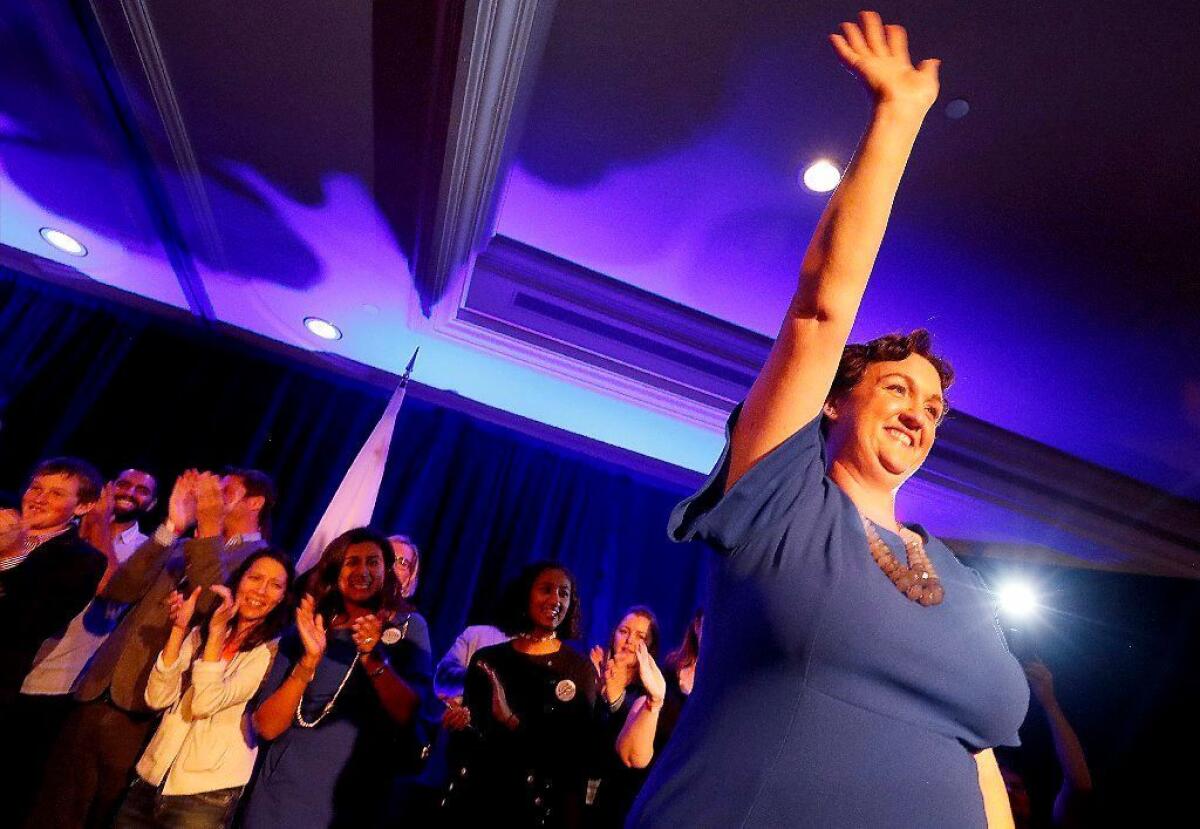 IRVINE, CALIF. .. - NOV. 6, 2018. Congressional candidate Katie Porter waves to supporters after giving a speech at a campaign party in the Irvine Hilton on Tuesday night, Nov. 6, 2018. (Luis Sinco/Los Angeles Times)