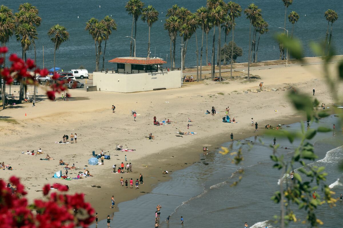 San Pedro, California,-Aug. 13, 2020-People escape the heat at Cabrillo Beach in San Pedro. (Carolyn Cole/Los Angeles Times)