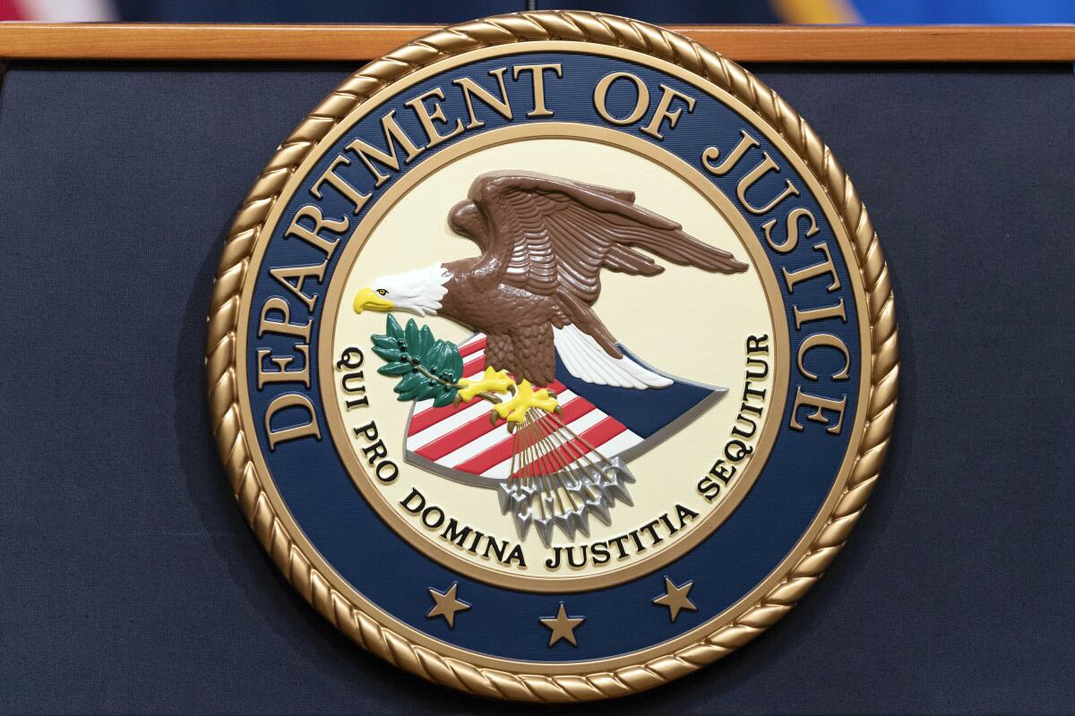 The Department of Justice seal.