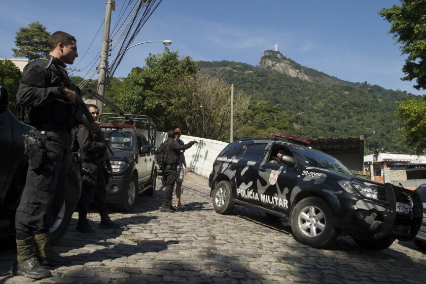 Military police forces carry out an operation at Guararapes slum in Rio de Janeiro. A Brazilian government crackdown on crime is being credited with lowering demand for bulletproof cars among the wealthy in Rio.