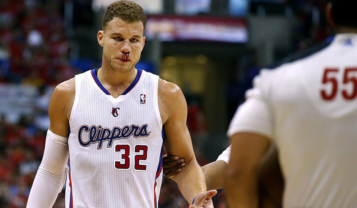 Clippers power forward Blake Griffin stares down referee Bill Kennedy (55) after he was bloodied by an elbow to the nose by Thunder power forward Serge Ibaka (not pictured) in the second half. No foul was called on the play.