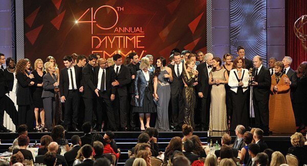 The cast and crew of "Days of Our Lives" accept the award for outstanding drama series at the 40th Daytime Emmy Awards.