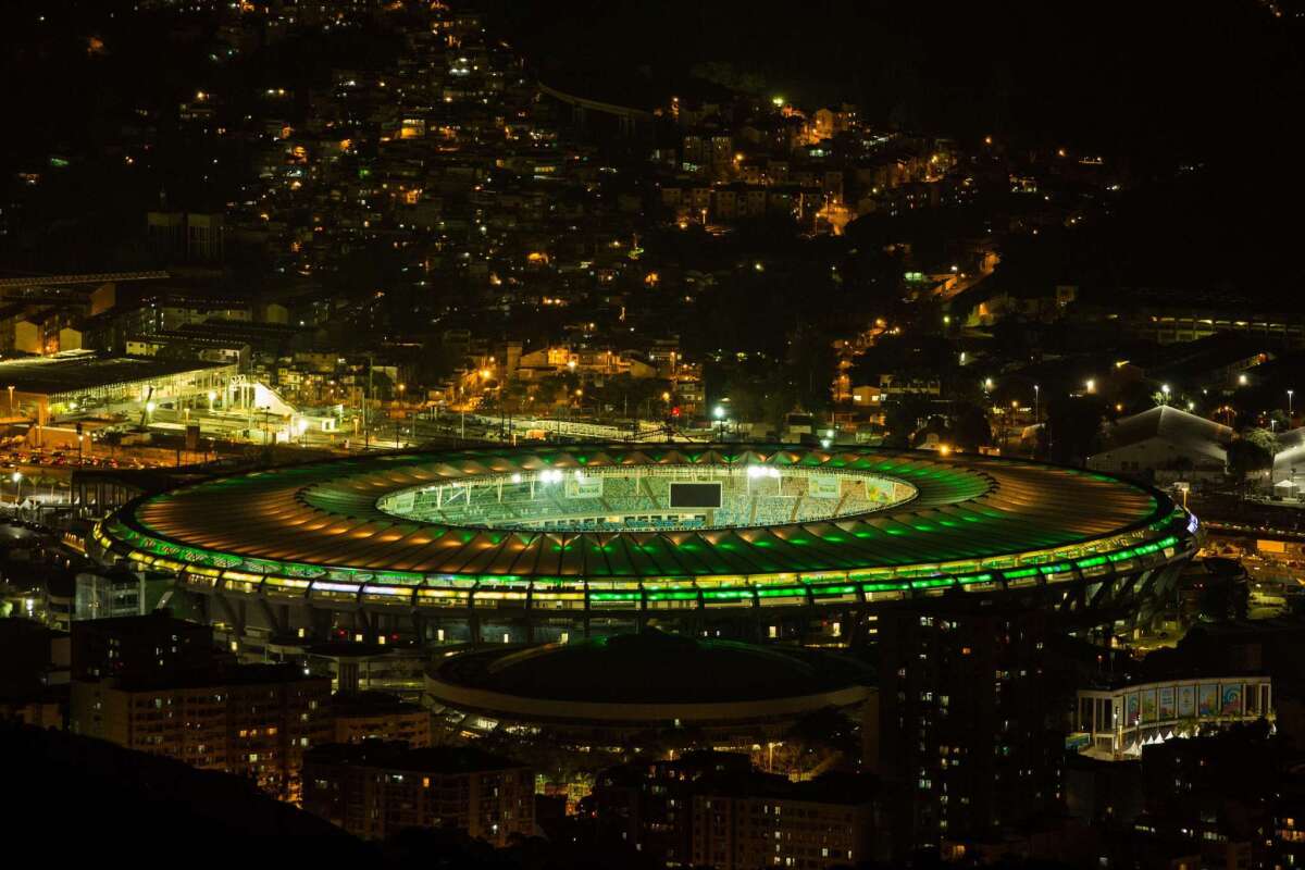 Maracana Stadium in Rio de Janeiro is illuminated in the colors of the Brazilian flag in honor of the World Cup.