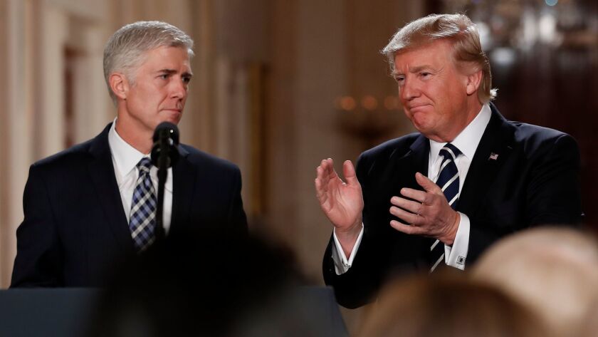 President Donald Trump applauds as he stands with Judge Neil Gorsuch in the East Room of the White House after announcing Gorsuch as his nominee for the Supreme Court Jan. 31.