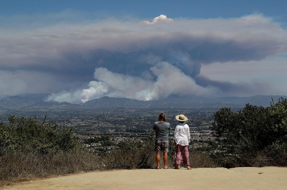 The Airport fire drastically increases in size as seen from Alta Laguna Park on Tuesday.