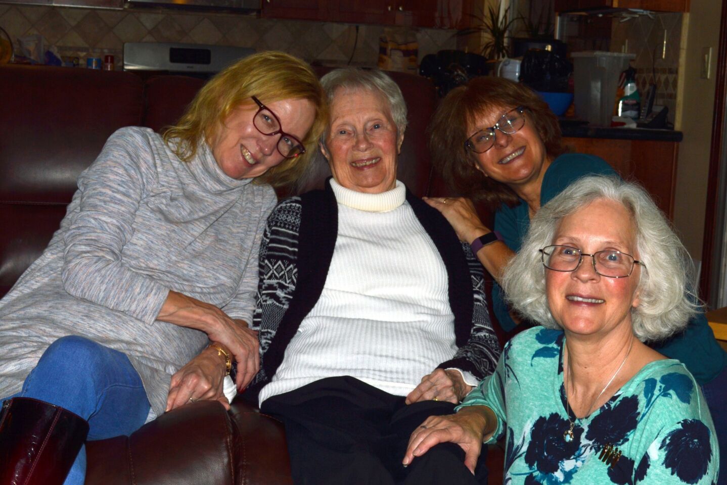 From left to right: Tierrasanta resident Cynthia Leigh sits with her mom, Betty Marks, and sisters Carol Dickerson and Cathy Paredes. The three sisters are the caregivers for Marks, who lives in the Cadence at Poway Gardens memory care facility.