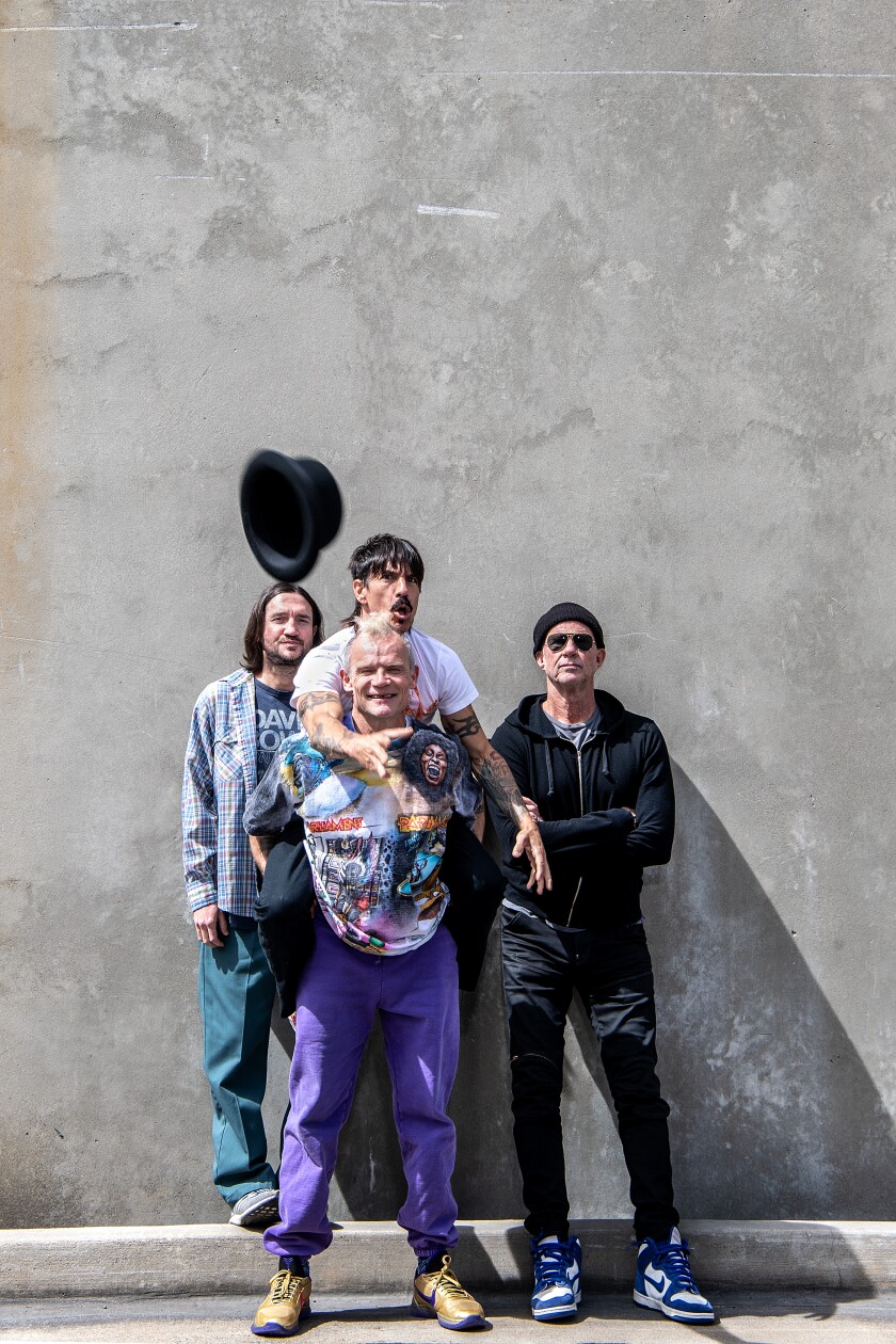 Four guys goofing off for the camera.