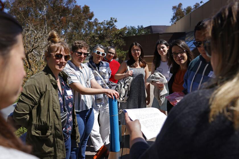 San Diego CA - March 19: People interact during a rehearsal for a new play called "Letters from Home," at UC San Diego on Wednesday, March 20, 2024. The interactive play will premiere in La Jolla Playhouse's 2024 Without Walls Festival April 4-7. (K.C. Alfred / The San Diego Union-Tribune)