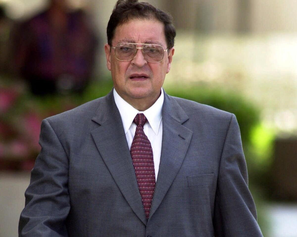 Former Salvadoran National Guard head Carlos Eugenio Vides Casanova leaves Federal Court in West Palm Beach, Fla., in this Oct. 23, 2000 photo.