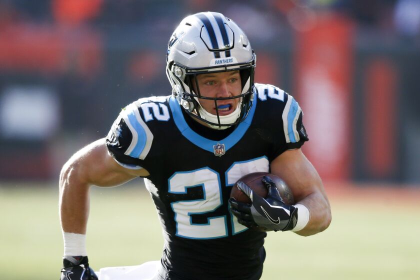 FILE - In this Dec. 9, 2018, file photo, Carolina Panthers running back Christian McCaffrey rushes during the first half of an NFL football game against the Cleveland Browns in Cleveland. The New Orleans Saints’ two-year run as division champion, including a dominant showing in 2018, has left other teams eager to prove there is still parity in the South. There is reason to expect a better showing by the division in 2019. Just ask Carolina quarterback Cam Newton, who will be handing off to Christian McCaffrey, one of the league’s most dominant backs. (AP Photo/Ron Schwane, File)