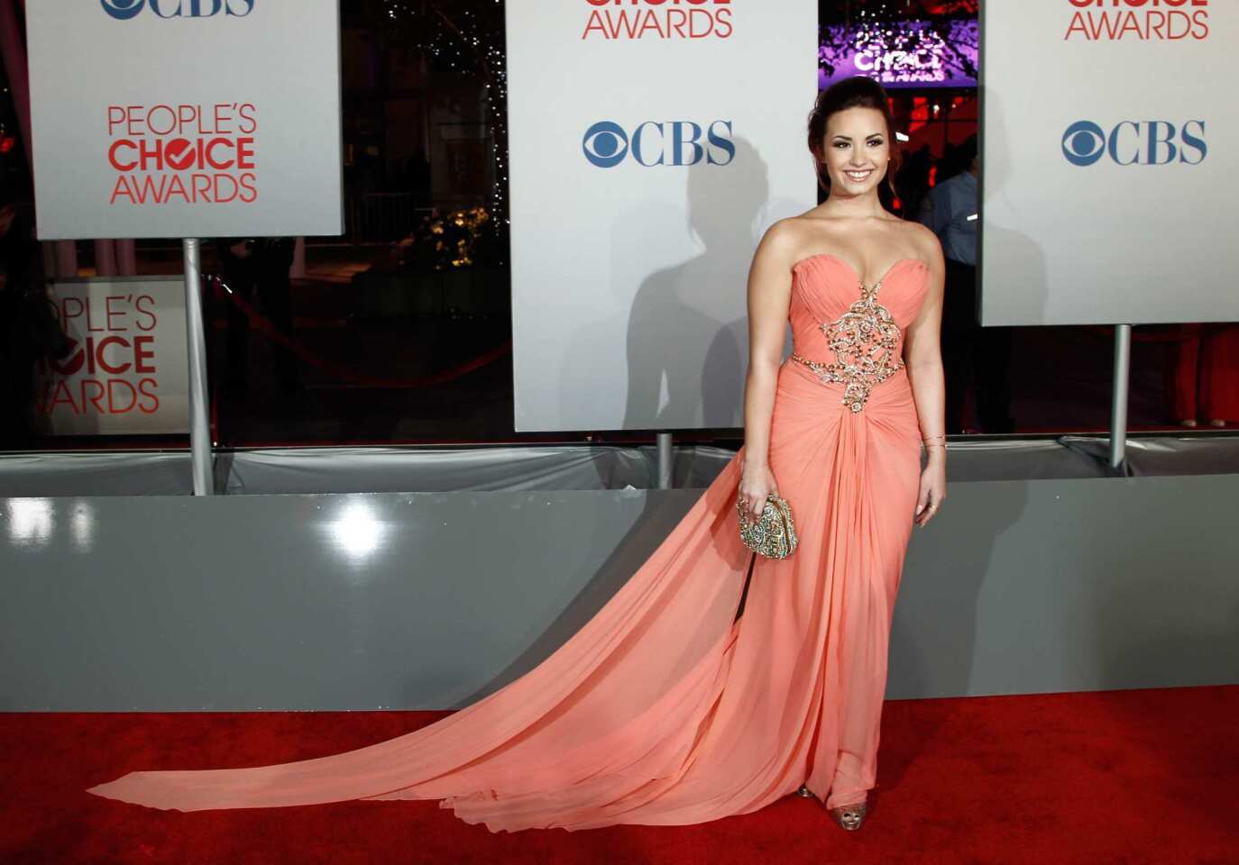 Demi Lovato in a peach Marchesa gown that looked better suited to "Dancing With the Stars" than an awards show red carpet.